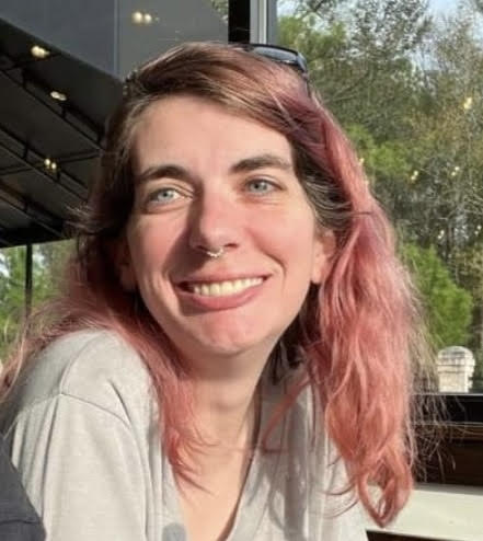 picture of Ashley smiling with sun shining on face